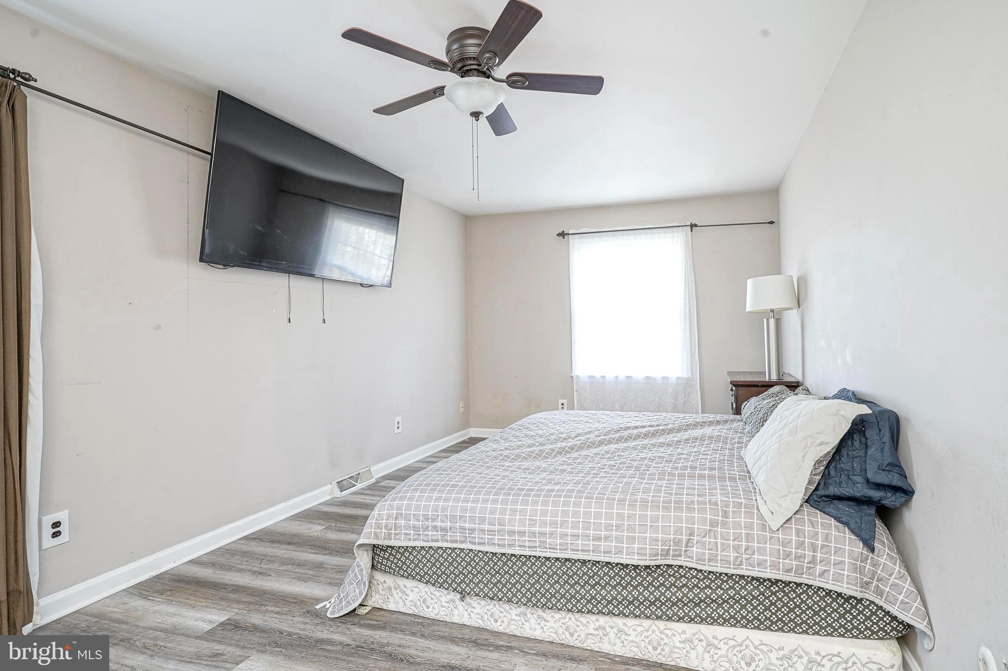 30 Tool Lane Williamstown, NJ 08094 - Photo 18 of 38 a bedroom with a bed and a flat screen tv