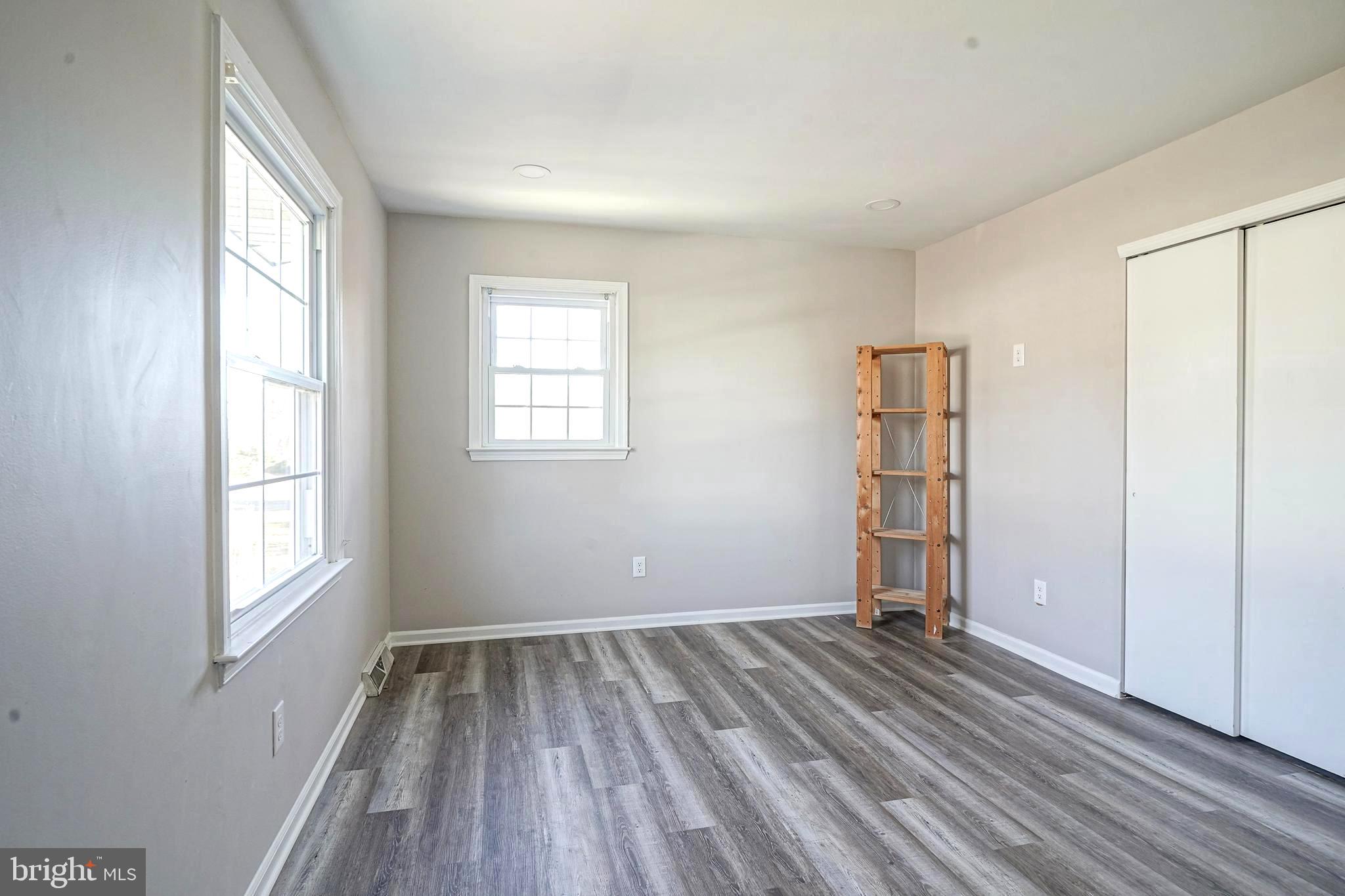 30 Tool Lane Williamstown, NJ 08094 - Photo 26 of 38 an empty room with wooden floor and windows