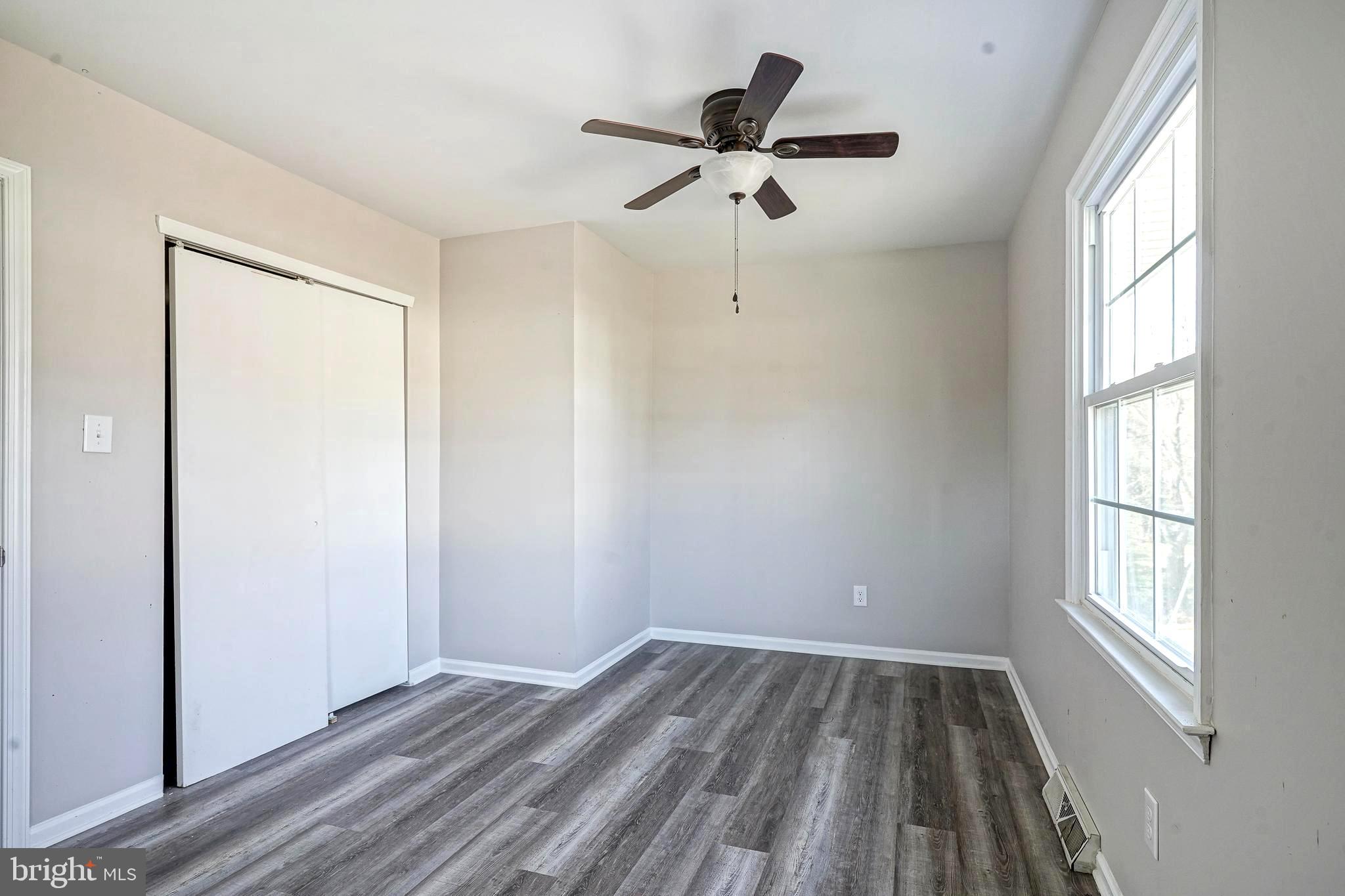 30 Tool Lane Williamstown, NJ 08094 - Photo 29 of 38 wooden floor in an empty room with a window