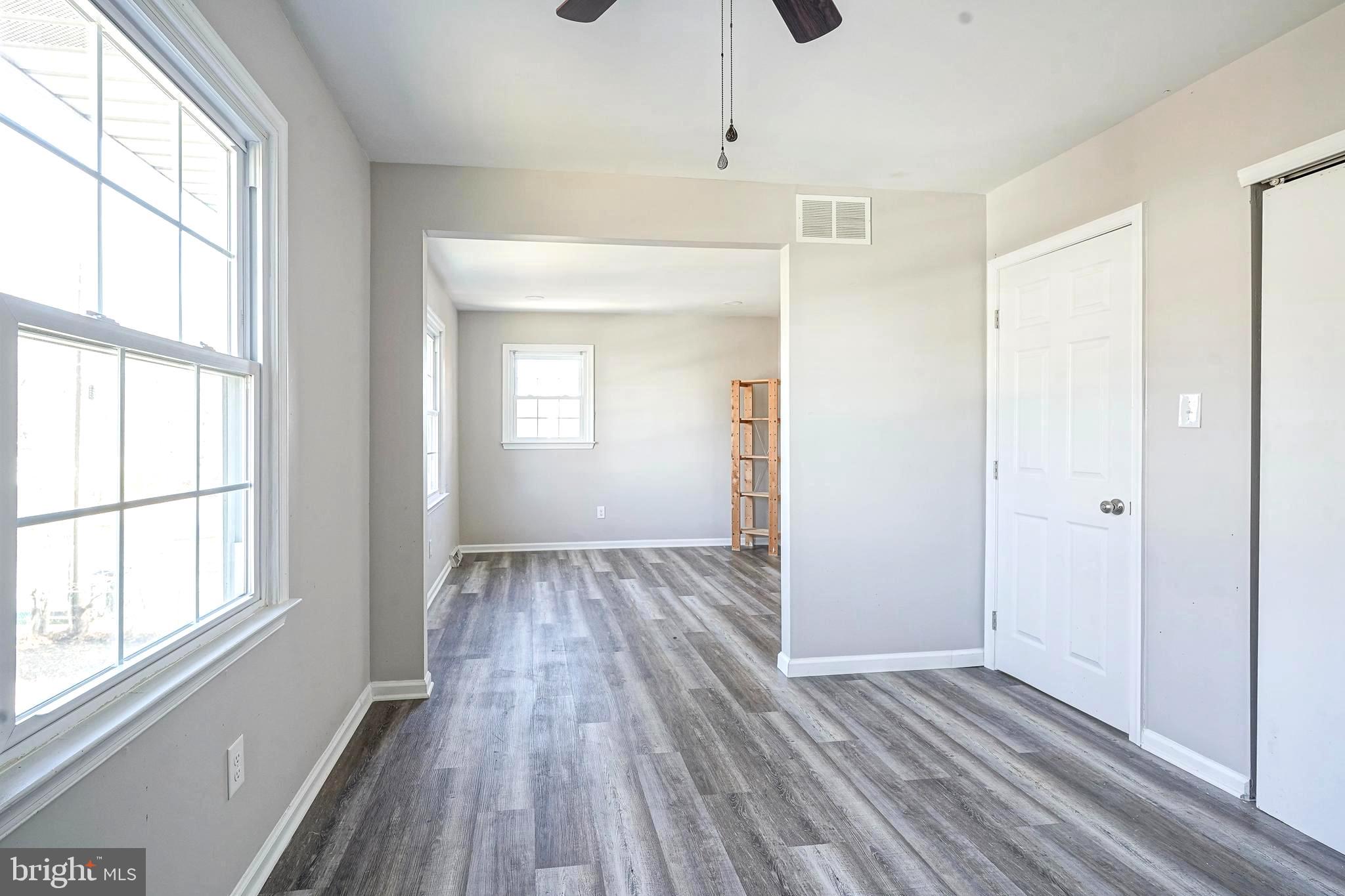 30 Tool Lane Williamstown, NJ 08094 - Photo 31 of 38 a view of an empty room with wooden floor and a window