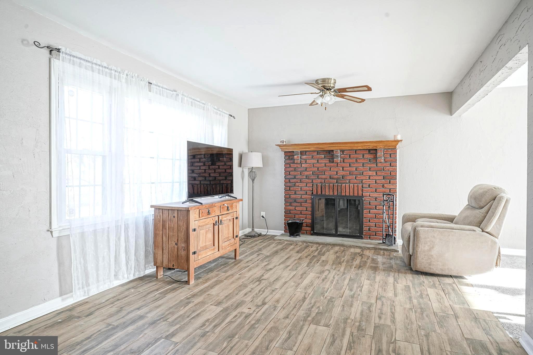 30 Tool Lane Williamstown, NJ 08094 - Photo 4 of 38 a living room with furniture and a fireplace