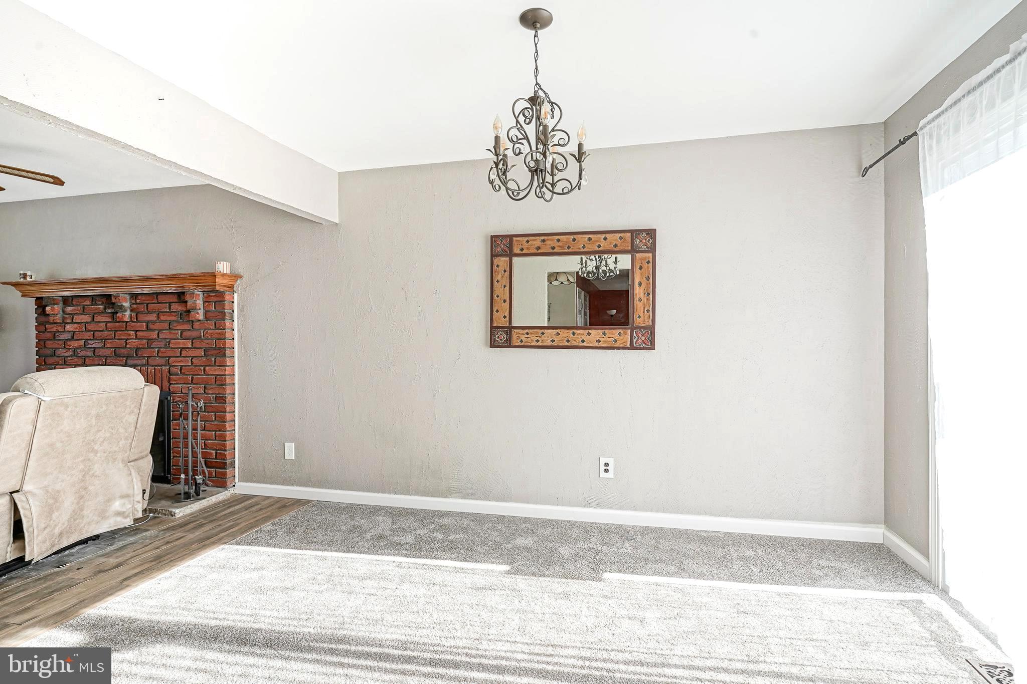 30 Tool Lane Williamstown, NJ 08094 - Photo 8 of 38 a view of a livingroom with wooden floor and a chandelier