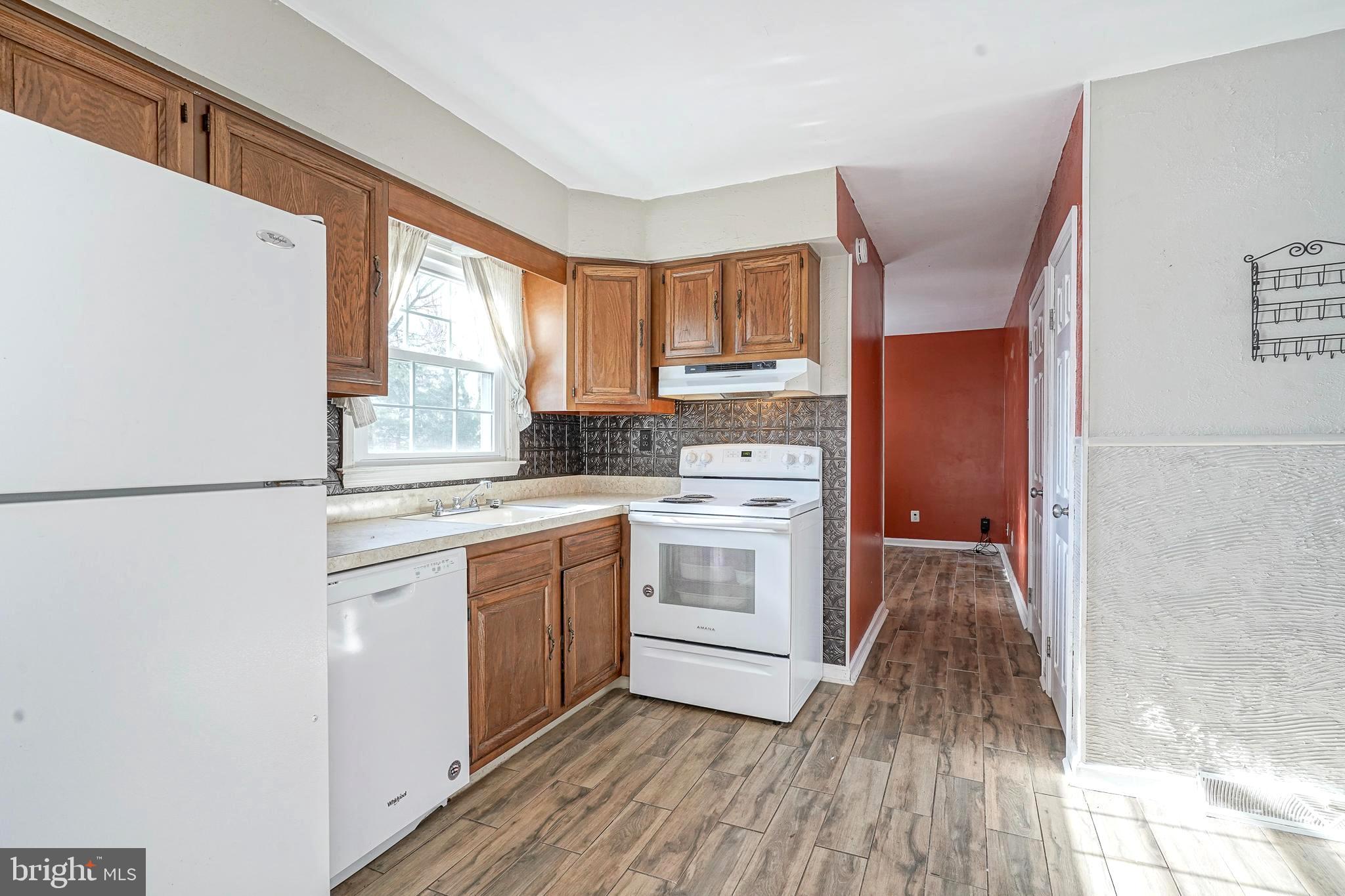 30 Tool Lane Williamstown, NJ 08094 - Photo 10 of 38 a kitchen with white cabinets and white appliances