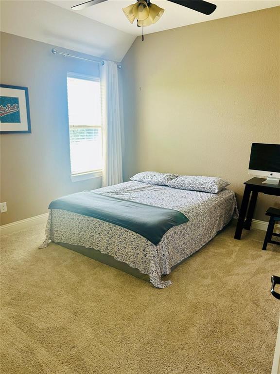 13021 Scotch Pine Drive Frisco, TX 75035 - Photo 13 of 15 a bed sitting in a bedroom next to a window