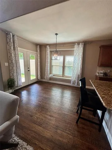 a view of livingroom with furniture wooden floor and windows