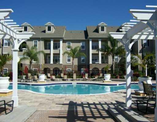 3583 Conroy Road, Unit 1126 Orlando, FL 32839 - Photo 1 of 1 a front view of a building with street view