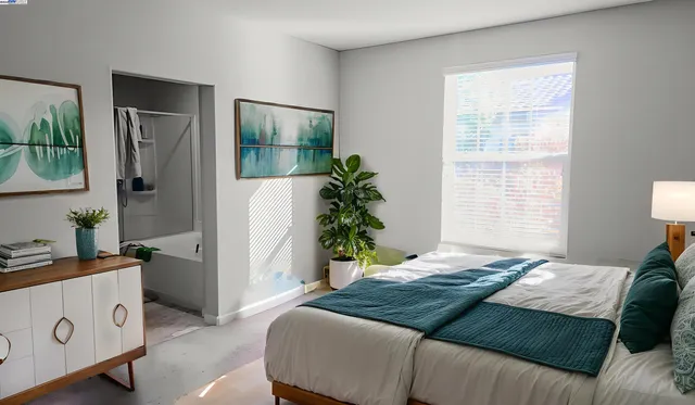 a bedroom with a bed and a window