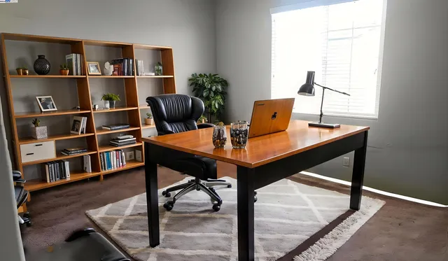 a view of a workspace with furniture
