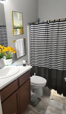a bathroom with a sink toilet and mirror