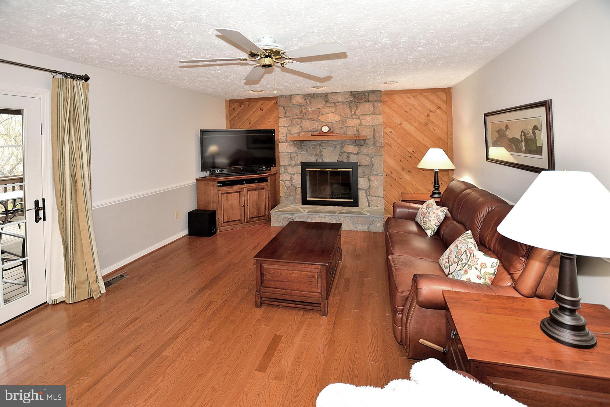 107 Rector Street Sterling, VA 20164 - Photo 11 of 29 Family room with wood burning fireplace