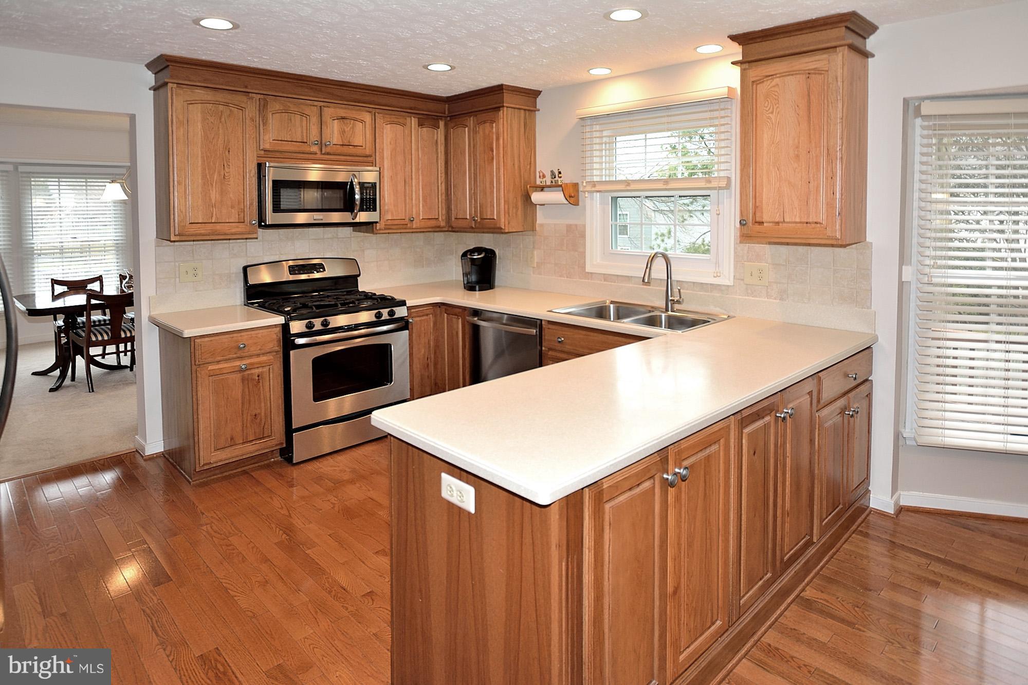 107 Rector Street Sterling, VA 20164 - Photo 7 of 29 Hickory Cabintry and Corian Counters