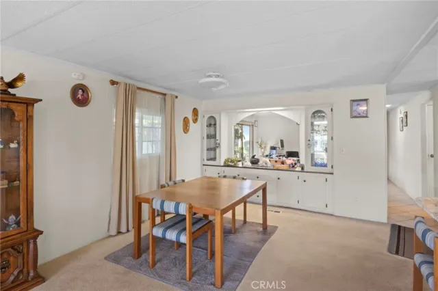 a view of a dining room with furniture and window