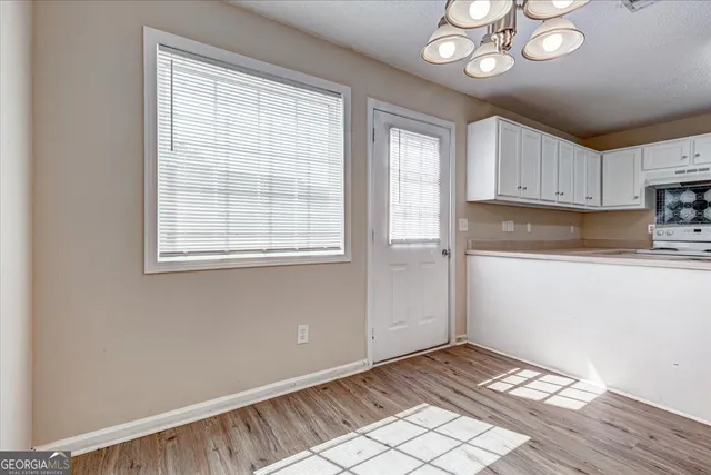 a view of an empty room with a window