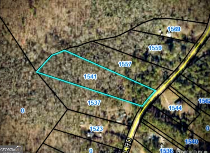 a view of staircase with wooden floor and stairs in the background