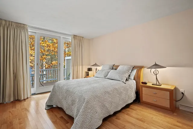 a bathroom with a granite countertop sink a mirror and a shower