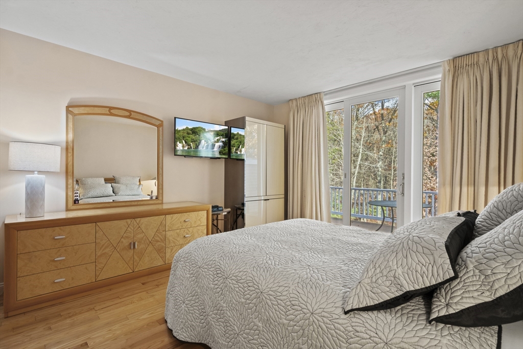 36 Caldwell Farm Road, Unit 36 Newbury, MA 01922 - Photo 20 of 42 a bedroom with a bed and a dresser