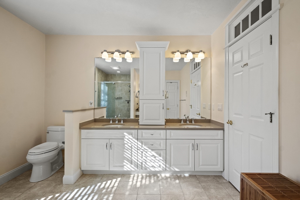 36 Caldwell Farm Road, Unit 36 Newbury, MA 01922 - Photo 23 of 42 a bathroom with a sink a toilet and a mirror