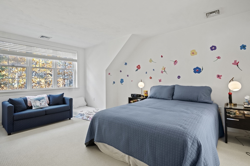 36 Caldwell Farm Road, Unit 36 Newbury, MA 01922 - Photo 24 of 42 a spacious bedroom with a bed couch and a window