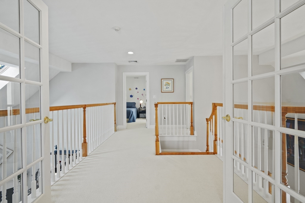 36 Caldwell Farm Road, Unit 36 Newbury, MA 01922 - Photo 28 of 42 a view of a hallway with a livingroom with entryway