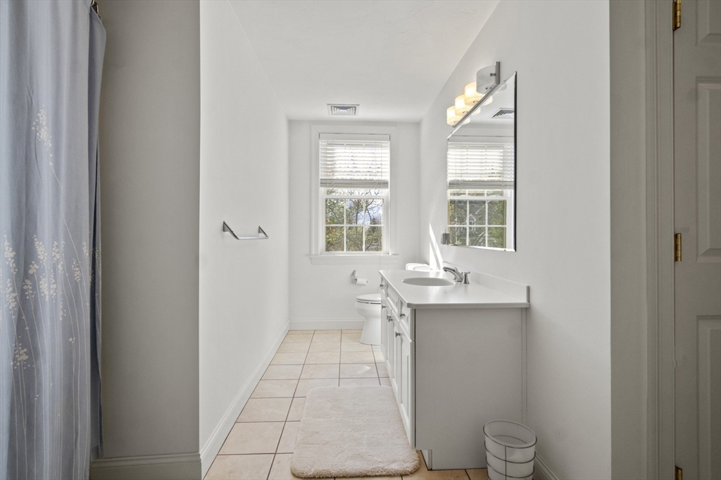 36 Caldwell Farm Road, Unit 36 Newbury, MA 01922 - Photo 29 of 42 a bathroom with a sink toilet and window