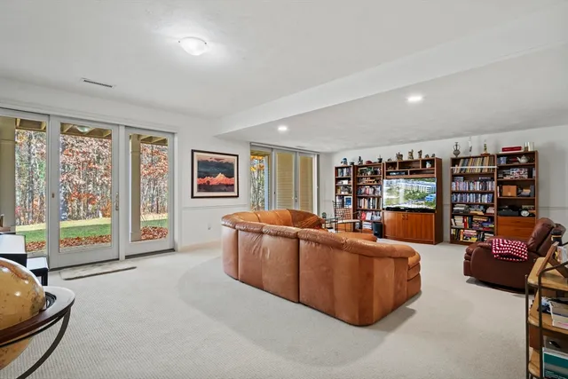 a bathroom with a granite countertop toilet sink and mirror