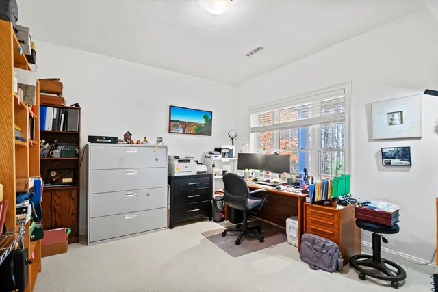 an aerial view of a house with a yard pool a patio and outdoor seating