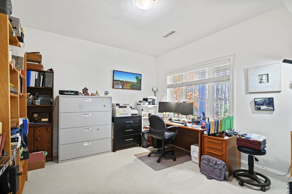36 Caldwell Farm Road, Unit 36 Newbury, MA 01922 - Photo 34 of 42 a view of a workspace with furniture and a window