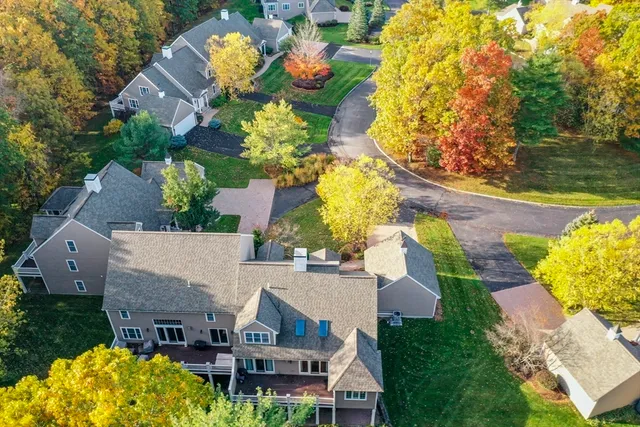 an aerial view of a house with a swimming pool