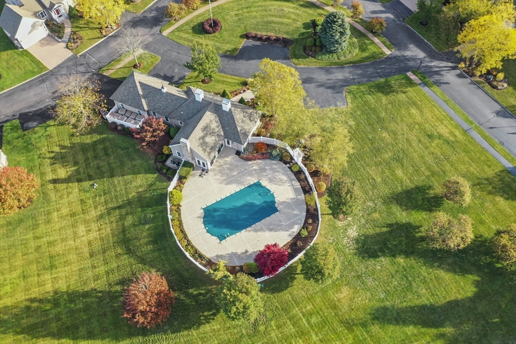 36 Caldwell Farm Road, Unit 36 Newbury, MA 01922 - Photo 38 of 42 an aerial view of a house with a swimming pool