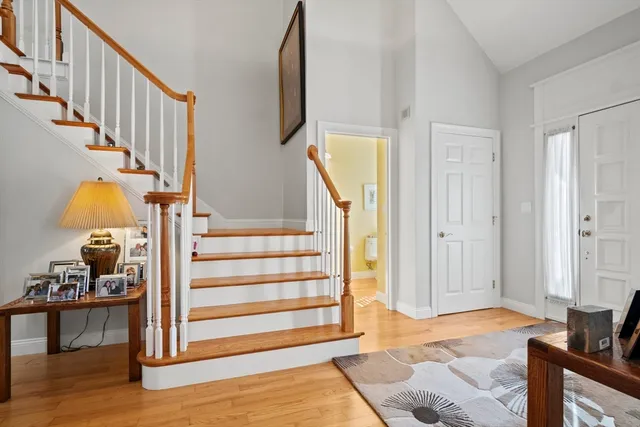 a living room with furniture fireplace and a large window