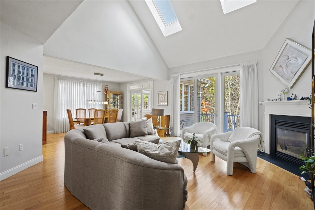 36 Caldwell Farm Road, Unit 36 Newbury, MA 01922 - Photo 8 of 42 a living room with furniture fireplace and a large window