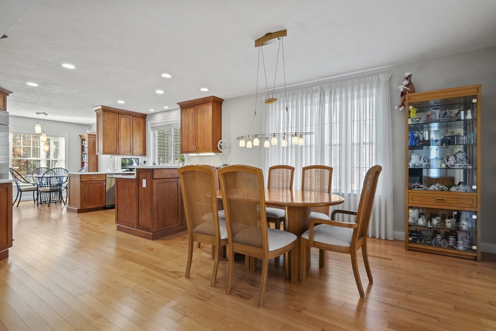 36 Caldwell Farm Road, Unit 36 Newbury, MA 01922 - Photo 9 of 42 a view of a dining room with furniture and wooden floor