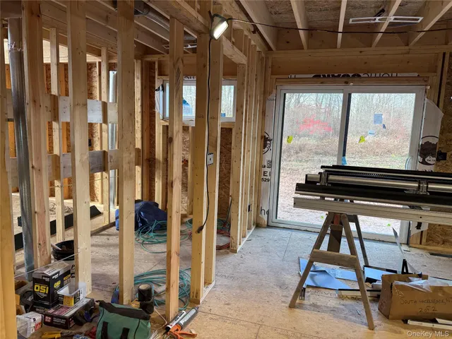 a view of a room with wooden walls