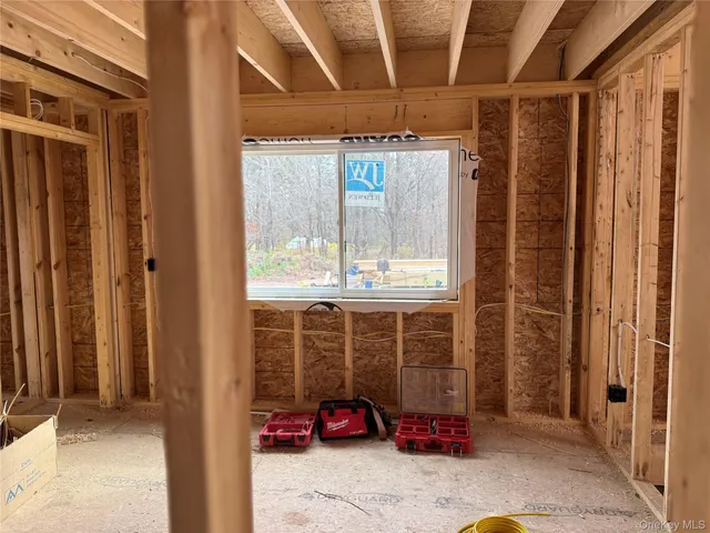 a view of a porch with furniture and front door