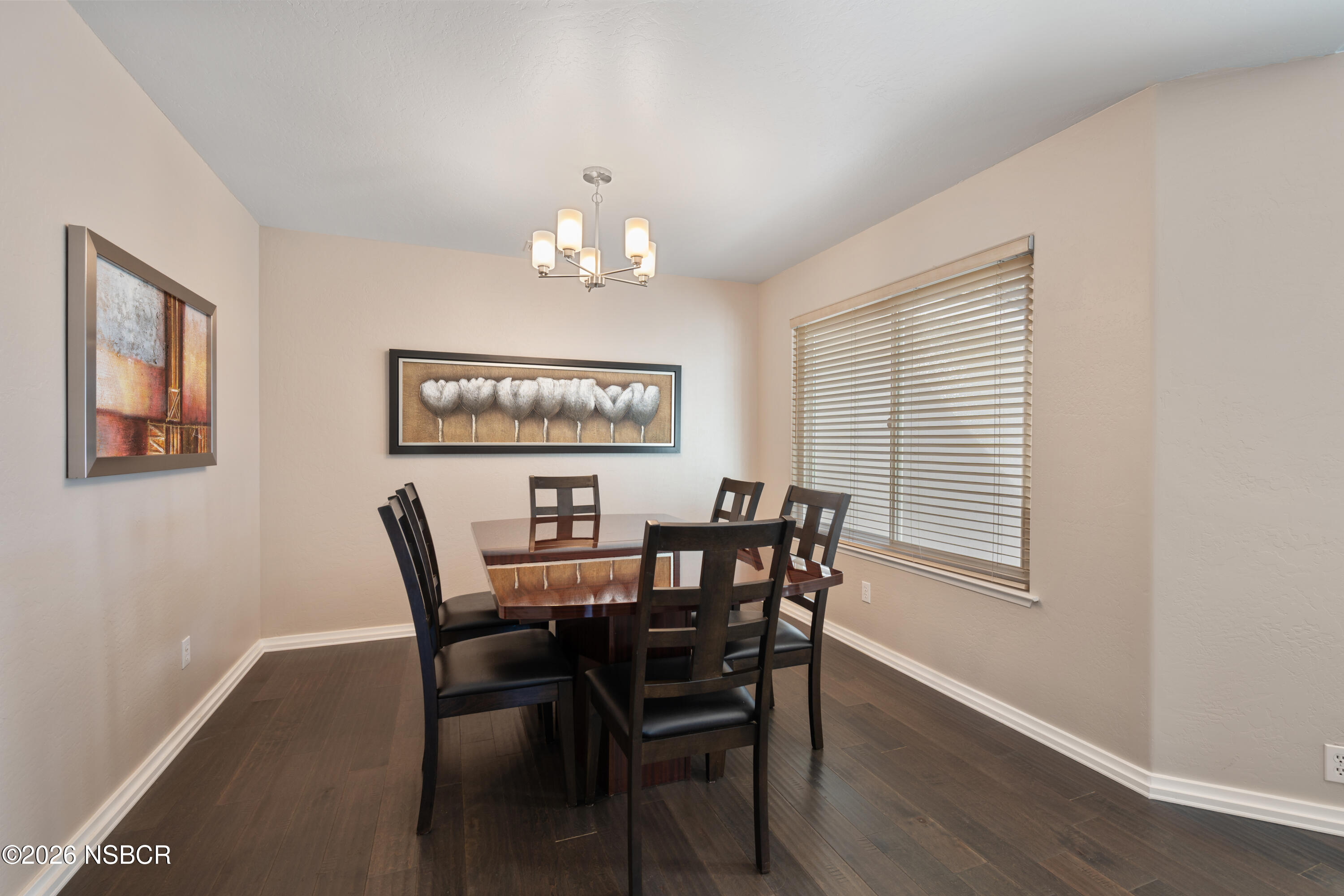 4473 Greenbrier Road Lompoc, CA 93436 - Photo 15 of 54 a view of a dining room with furniture and wooden floor