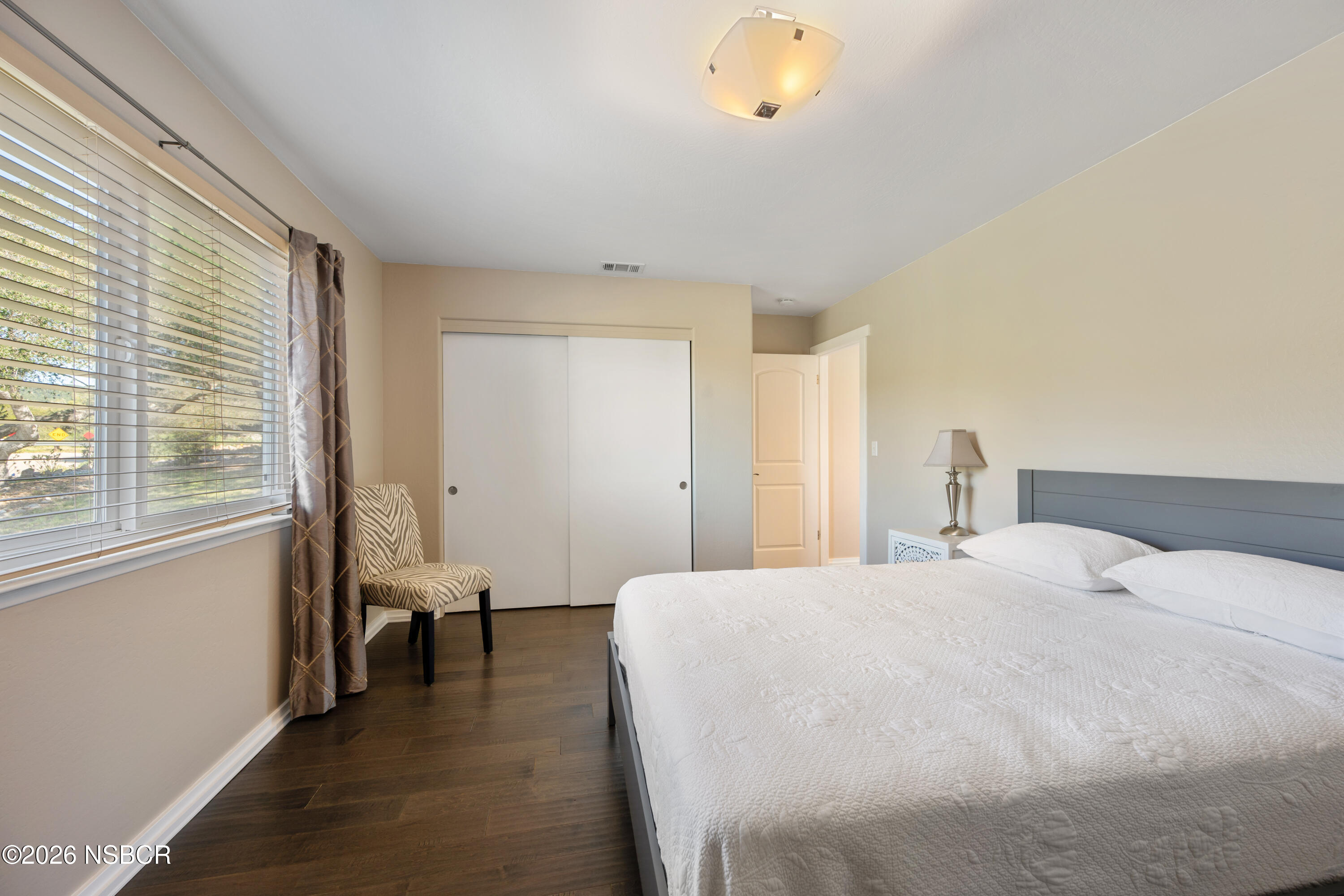 4473 Greenbrier Road Lompoc, CA 93436 - Photo 28 of 54 a spacious bedroom with a bed and a large window