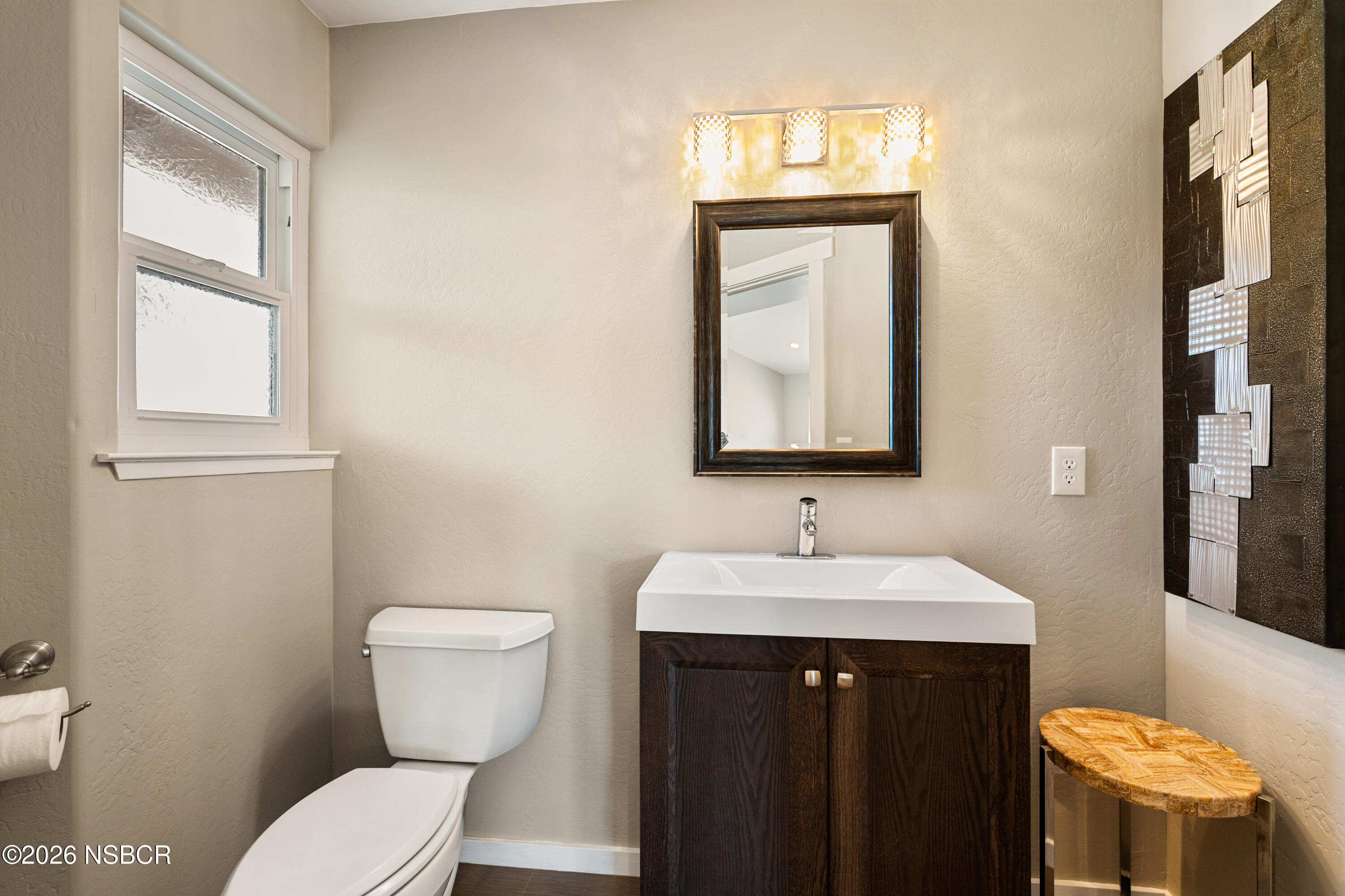 4473 Greenbrier Road Lompoc, CA 93436 - Photo 32 of 54 a bathroom with a toilet sink and mirror
