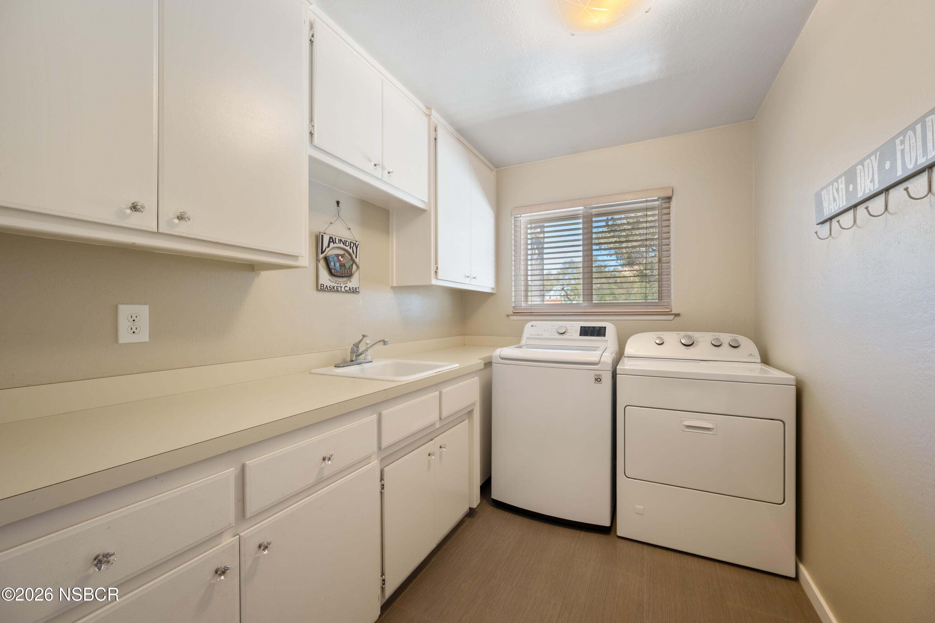 4473 Greenbrier Road Lompoc, CA 93436 - Photo 33 of 54 a utility room with closet dryer and washer