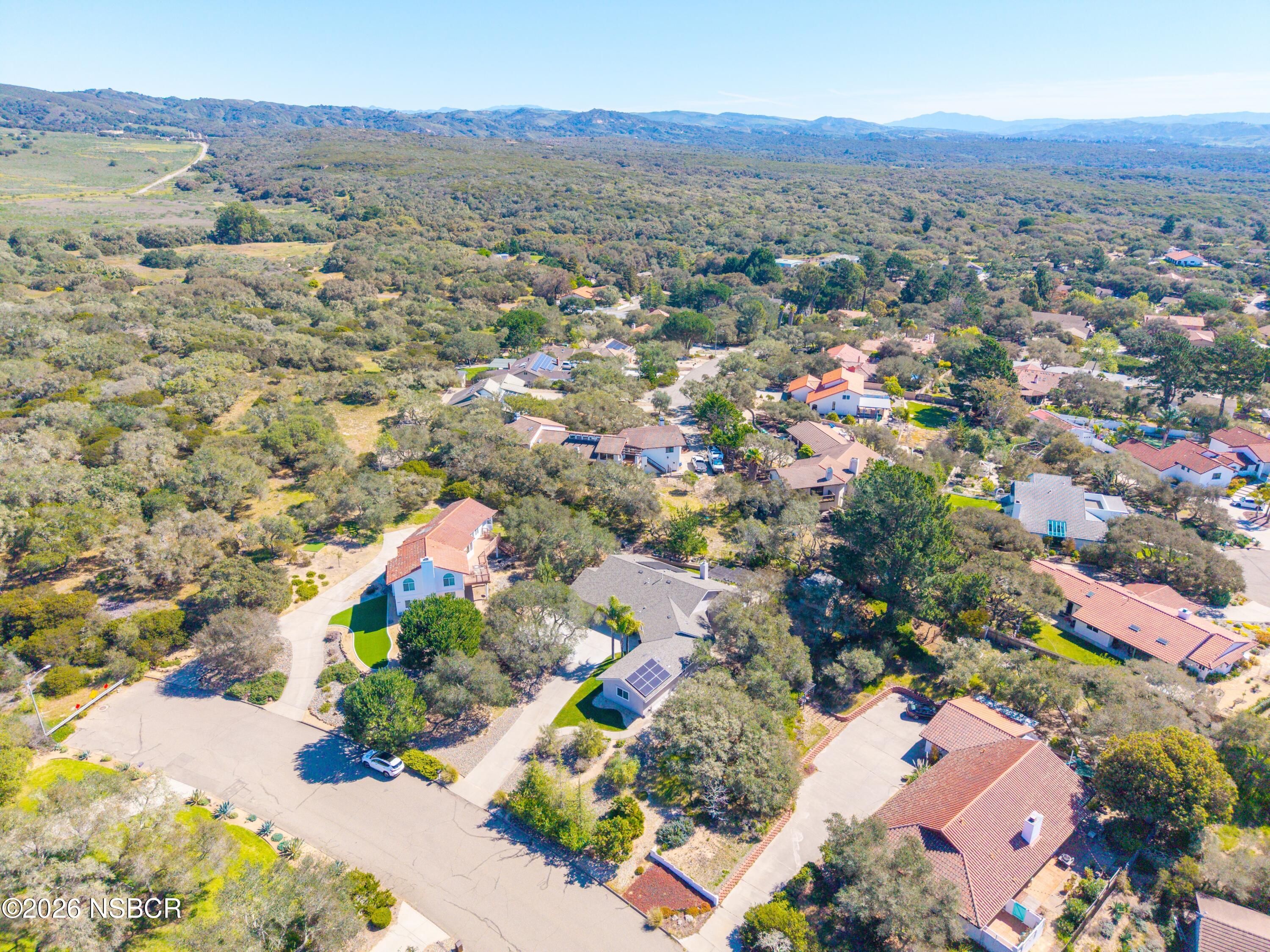 4473 Greenbrier Road Lompoc, CA 93436 - Photo 4 of 54 an aerial view of a city with lots of residential buildings and mountain view in back