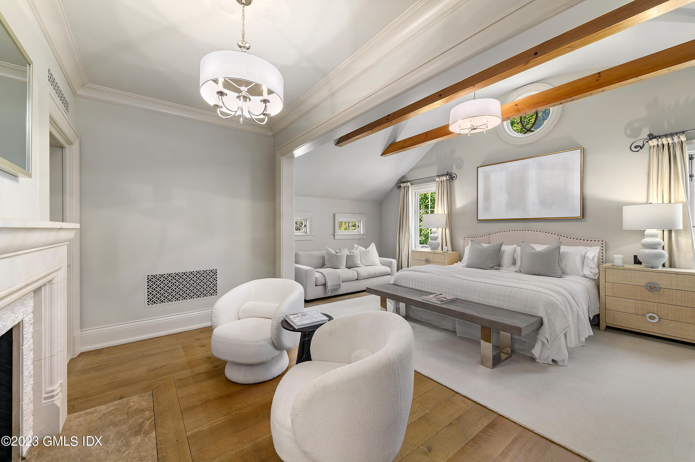 2 Martin Dale Greenwich, CT 06830 - Photo 18 of 53 a spacious bedroom with bed and a chandelier