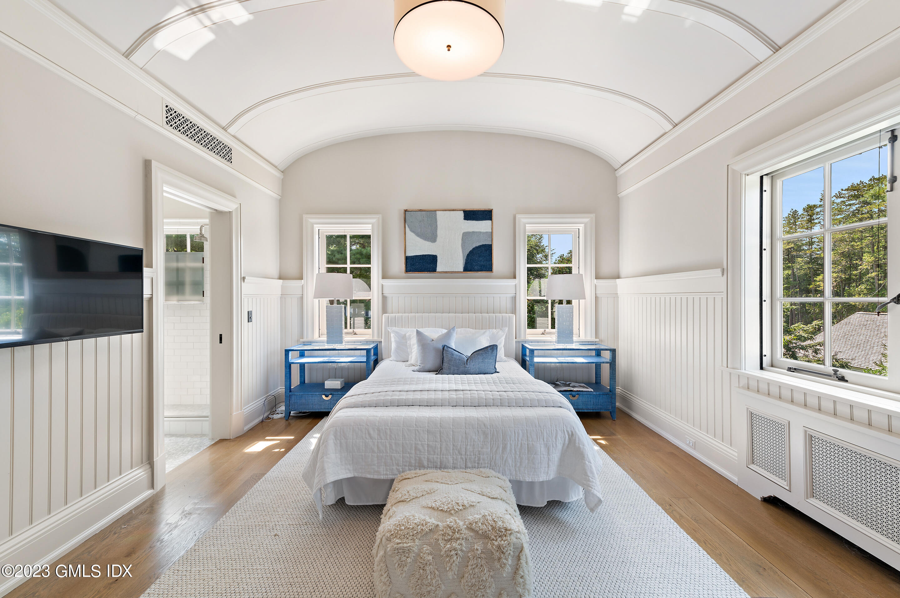 2 Martin Dale Greenwich, CT 06830 - Photo 27 of 53 a bedroom with a large bed and a large window