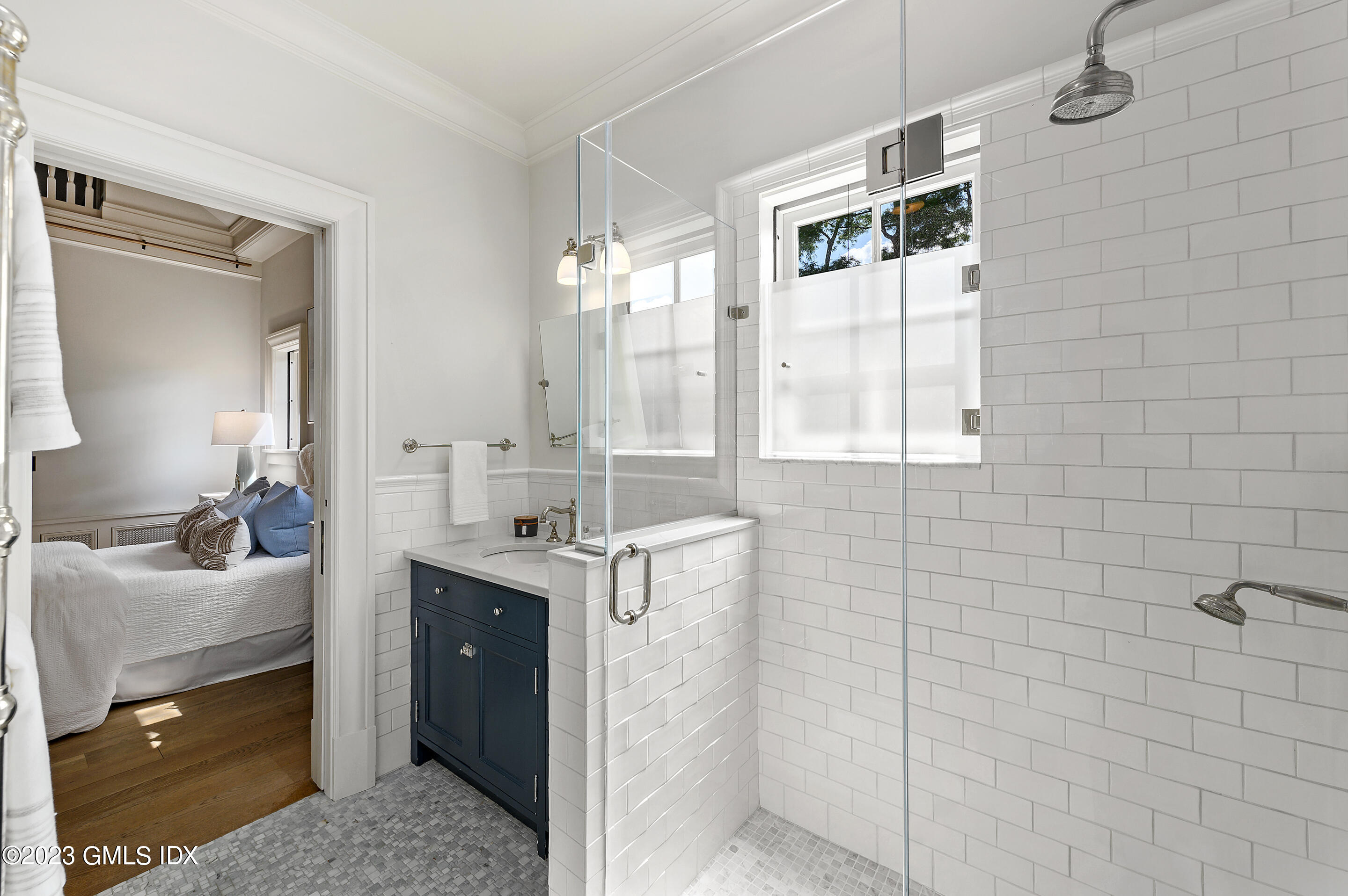 2 Martin Dale Greenwich, CT 06830 - Photo 28 of 53 a en suite bathroom with a granite countertop sink a mirror and shower