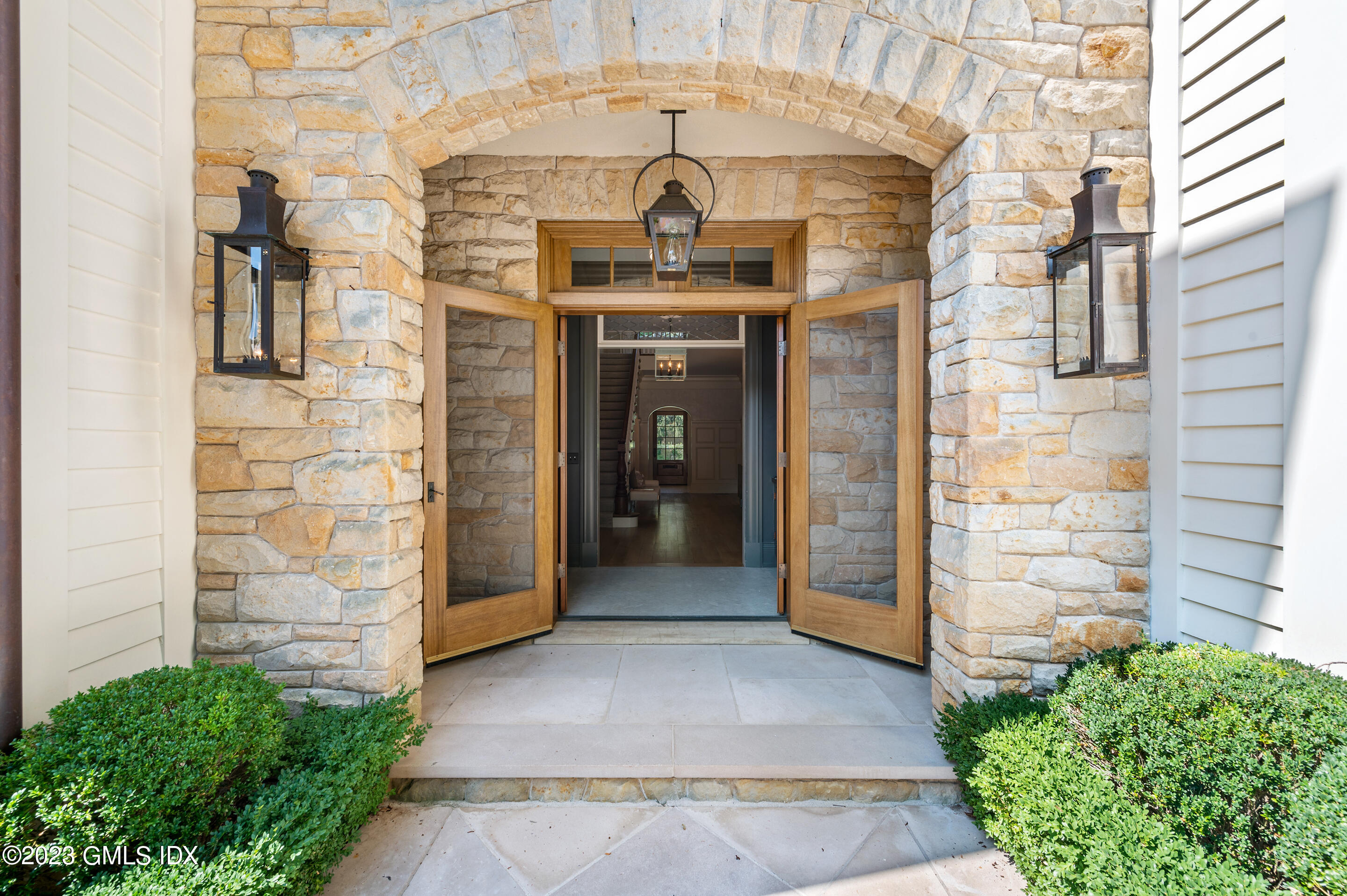 2 Martin Dale Greenwich, CT 06830 - Photo 42 of 53 a front view of a house with a garage