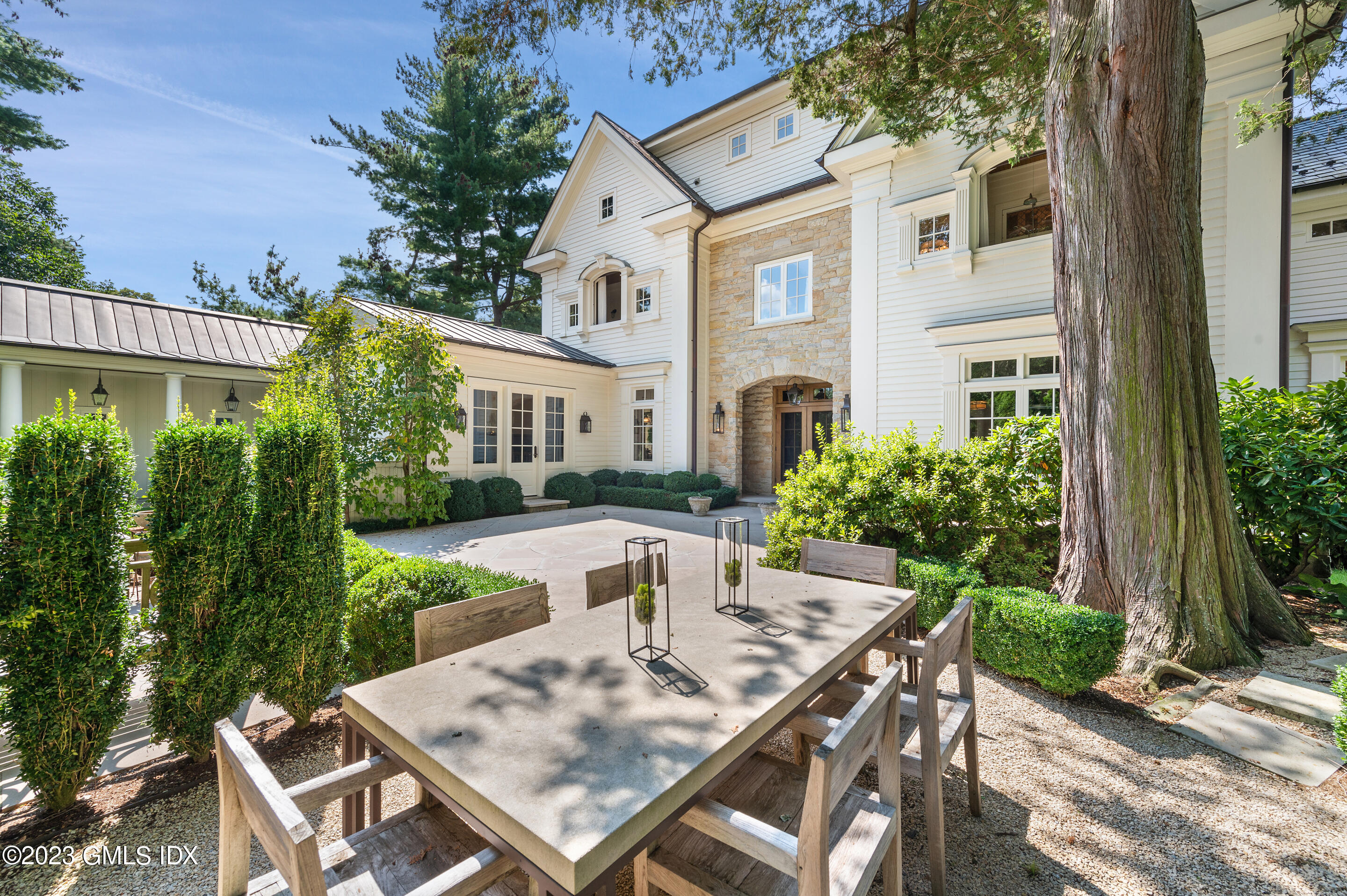 2 Martin Dale Greenwich, CT 06830 - Photo 45 of 53 a view of a patio with table and chairs and potted plants