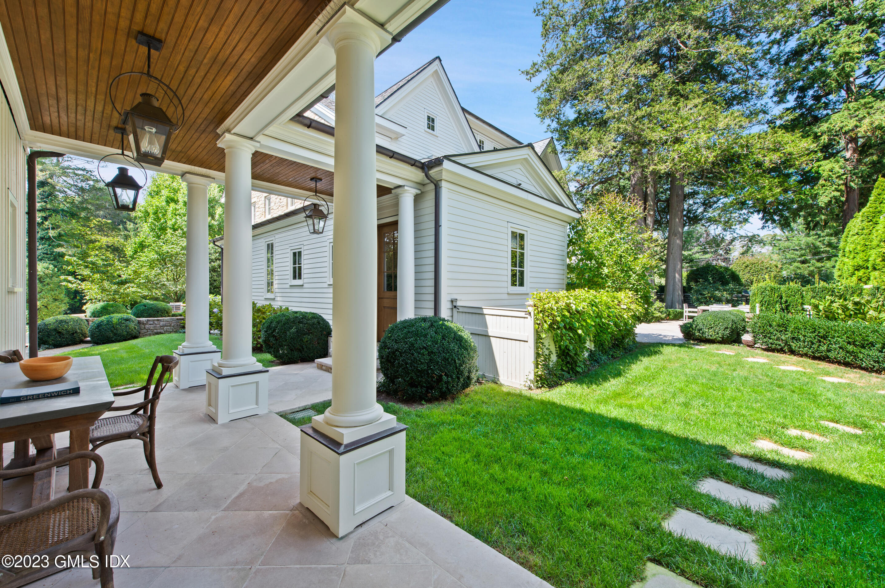 2 Martin Dale Greenwich, CT 06830 - Photo 47 of 53 a view of a patio with table and chairs potted plants and large tree