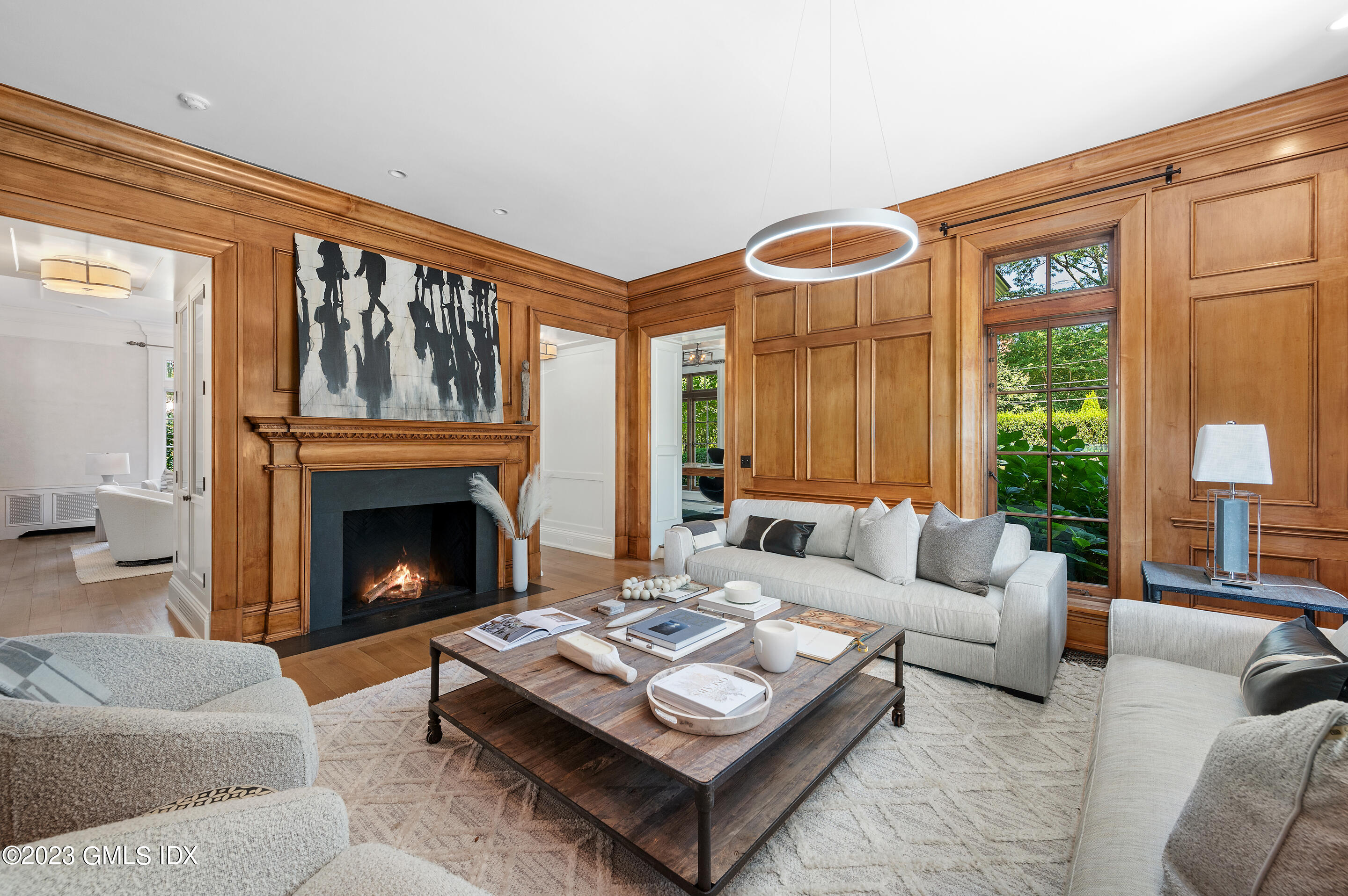 2 Martin Dale Greenwich, CT 06830 - Photo 8 of 53 a living room with furniture a fireplace and a large window