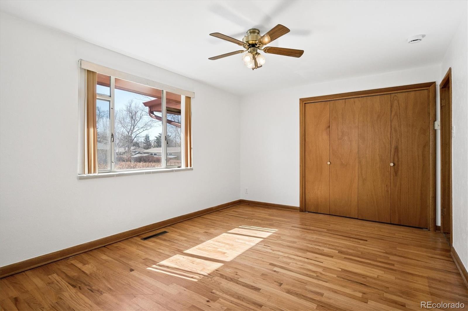 7505 West 47th Avenue Wheat Ridge, CO 80033 - Photo 20 of 35 a view of empty room with wooden floor