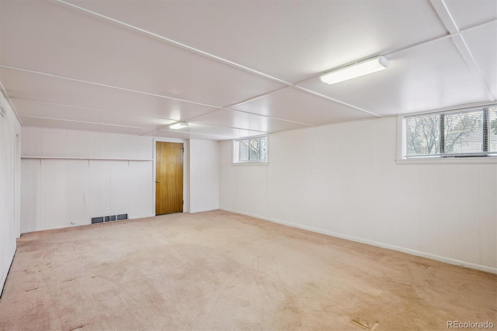 7505 West 47th Avenue Wheat Ridge, CO 80033 - Photo 26 of 35 an empty room with windows