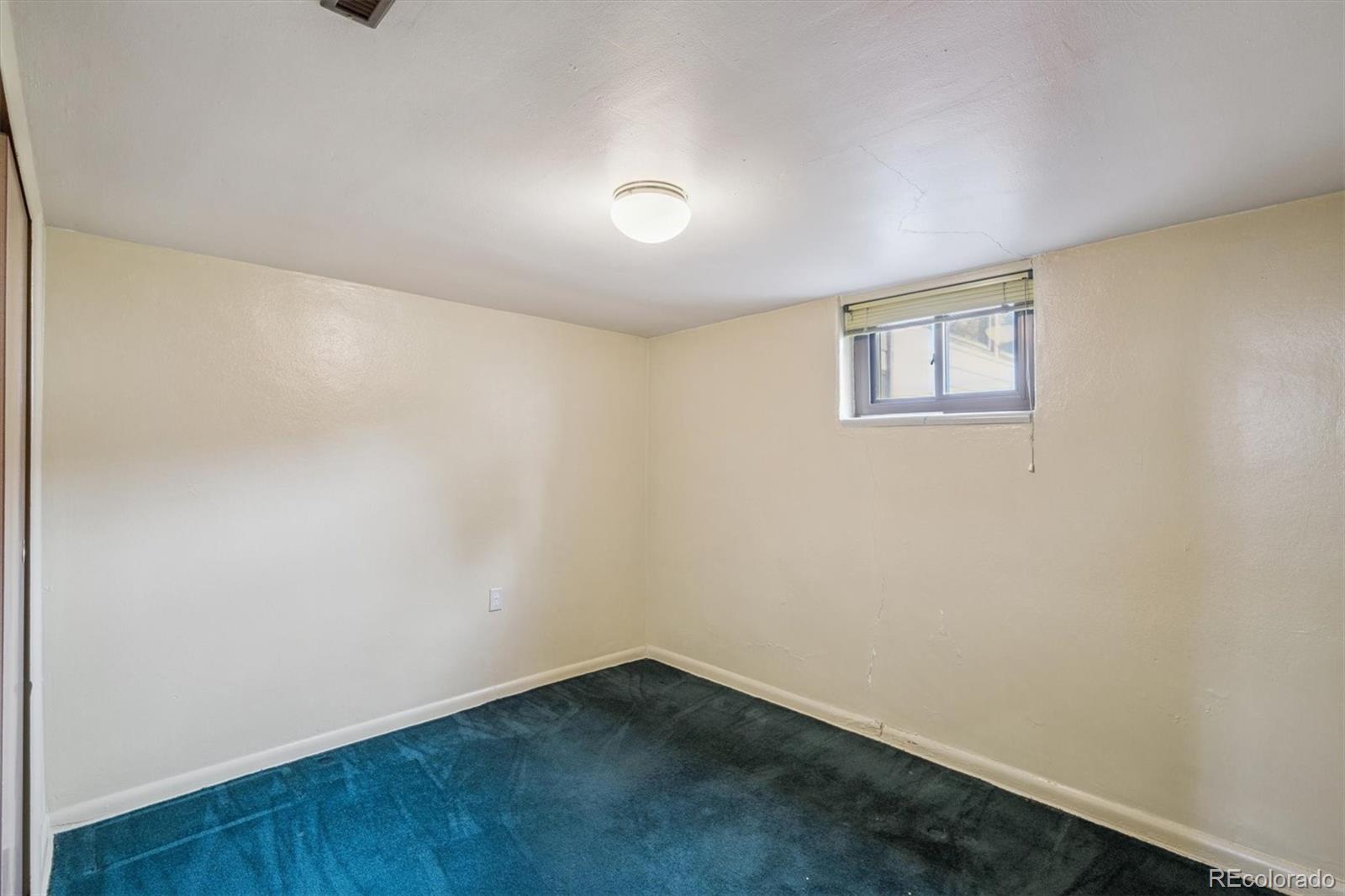 7505 West 47th Avenue Wheat Ridge, CO 80033 - Photo 27 of 35 an empty room with a workbench