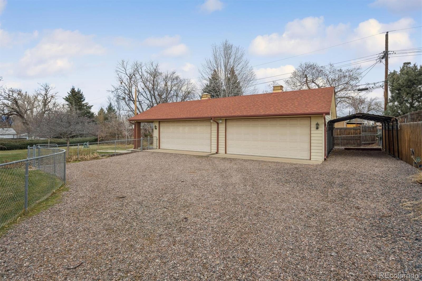 7505 West 47th Avenue Wheat Ridge, CO 80033 - Photo 3 of 35 a house view with a garden space